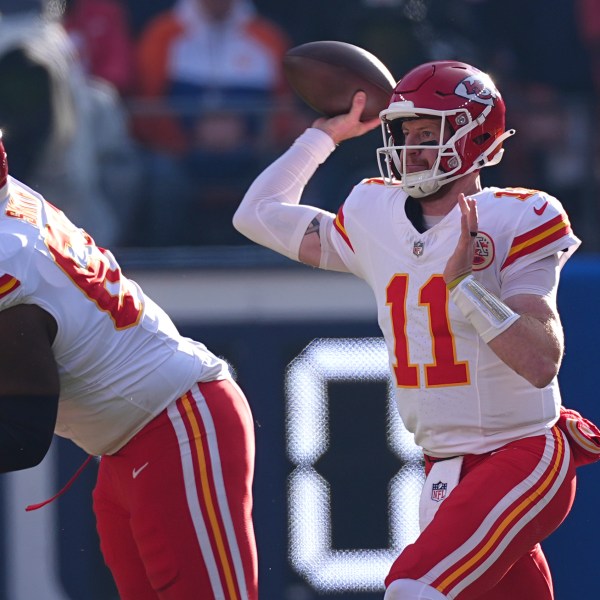 Kansas City Chiefs quarterback Carson Wentz throws during the first half of an NFL football game against the Denver Broncos Sunday, Jan. 5, 2025, in Denver. (AP Photo/David Zalubowski)