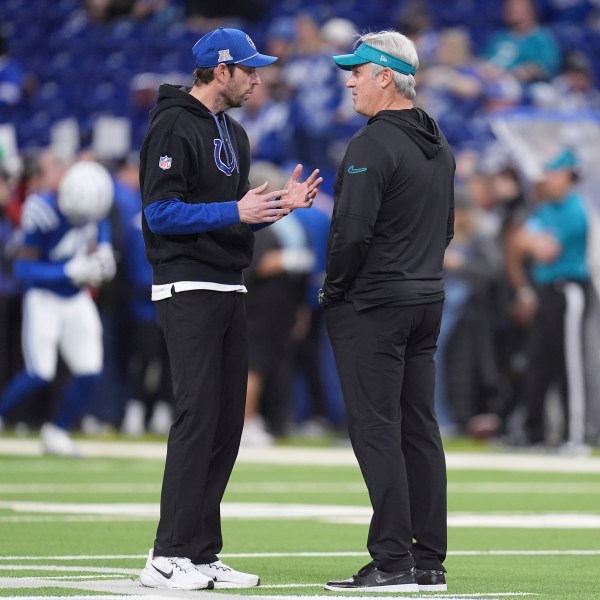 Indianapolis Colts head coach Shane Steichen, left, and Jacksonville Jaguars head coach Doug Pederson talk on the field before an NFL football game, Sunday, Jan. 5, 2025, in Indianapolis. (AP Photo/Michael Conroy)