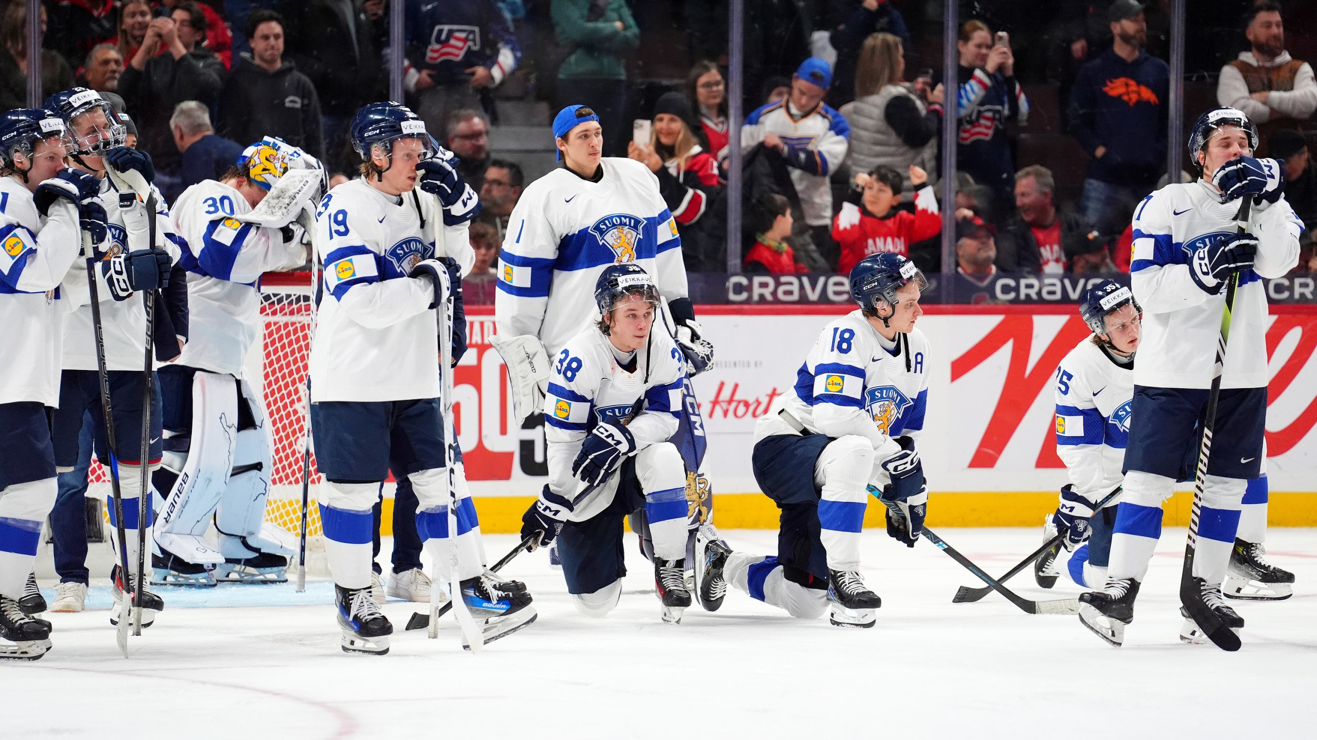 Finland players react following their overtime loss in the IIHF World Junior Hockey Championship gold medal game against the United States in Ottawa, Ontario, Sunday, Jan. 5, 2025. (Sean Kilpatrick/The Canadian Press via AP)