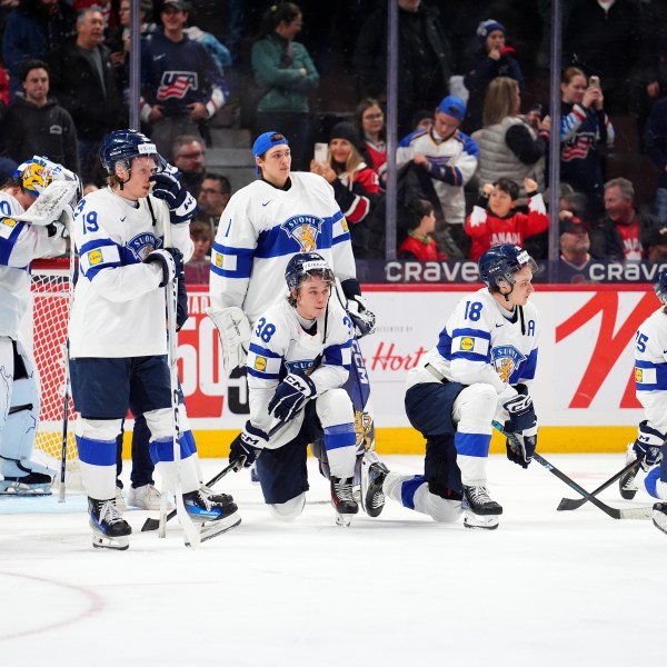 Finland players react following their overtime loss in the IIHF World Junior Hockey Championship gold medal game against the United States in Ottawa, Ontario, Sunday, Jan. 5, 2025. (Sean Kilpatrick/The Canadian Press via AP)