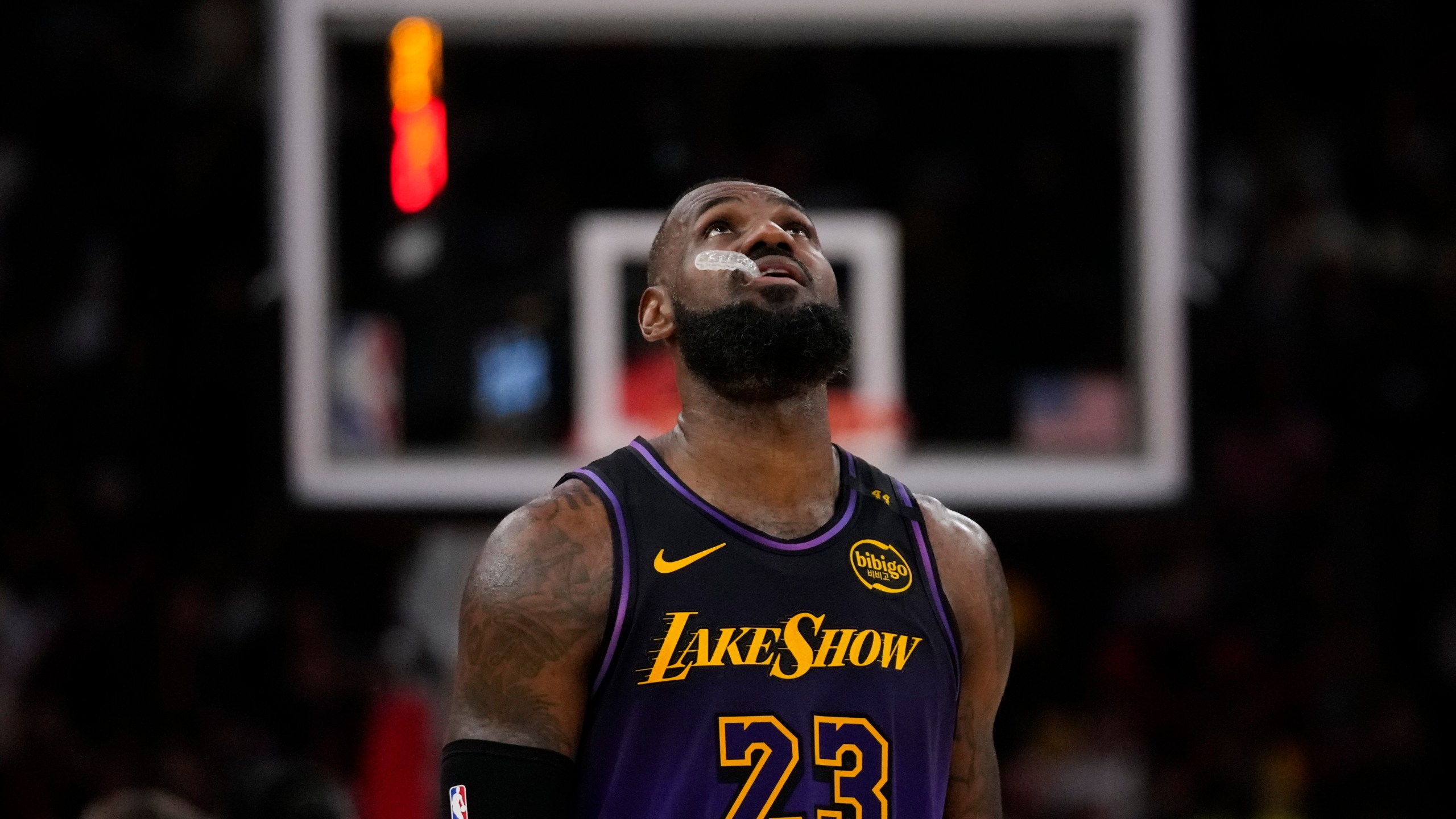 Los Angeles Lakers forward LeBron James (23) walks on the court during the second half of an NBA basketball game against the Houston Rockets in Houston, Sunday, Jan. 5, 2025. (AP Photo/Ashley Landis)