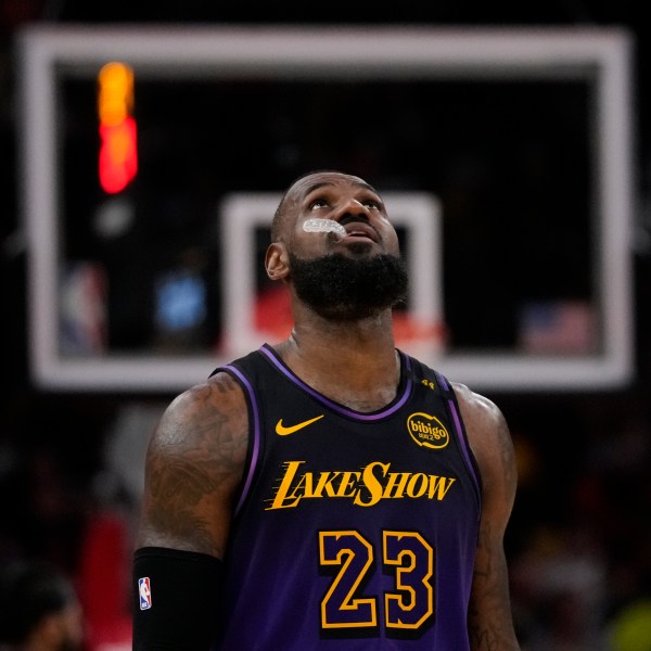 Los Angeles Lakers forward LeBron James (23) walks on the court during the second half of an NBA basketball game against the Houston Rockets in Houston, Sunday, Jan. 5, 2025. (AP Photo/Ashley Landis)