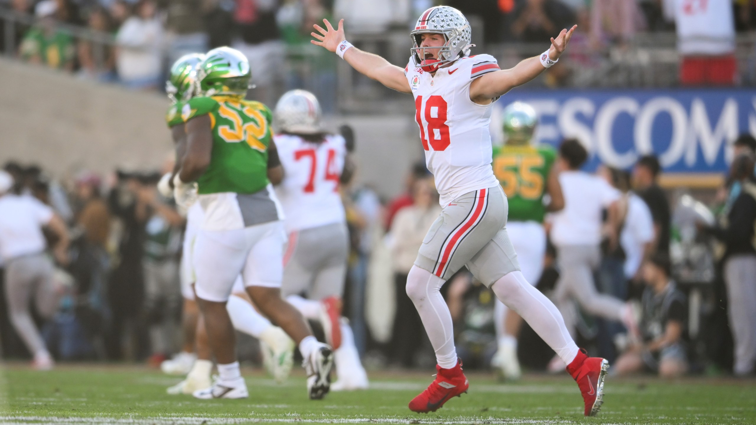 Ohio State quarterback Will Howard (18) celebrates a touchdown against Oregon during the first half in the quarterfinals of the Rose Bowl College Football Playoff, Wednesday, Jan. 1, 2025, in Pasadena, Calif. (AP Photo/Kyusung Gong)