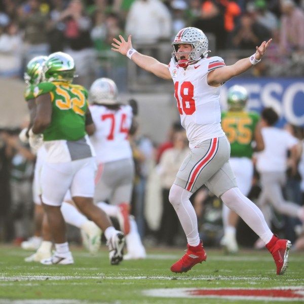 Ohio State quarterback Will Howard (18) celebrates a touchdown against Oregon during the first half in the quarterfinals of the Rose Bowl College Football Playoff, Wednesday, Jan. 1, 2025, in Pasadena, Calif. (AP Photo/Kyusung Gong)