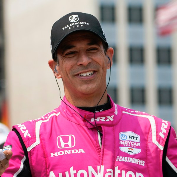 FILE - Helio Castroneves is introduced before the IndyCar Detroit Grand Prix auto race in Detroit, June 4, 2023. (AP Photo/Paul Sancya, file)