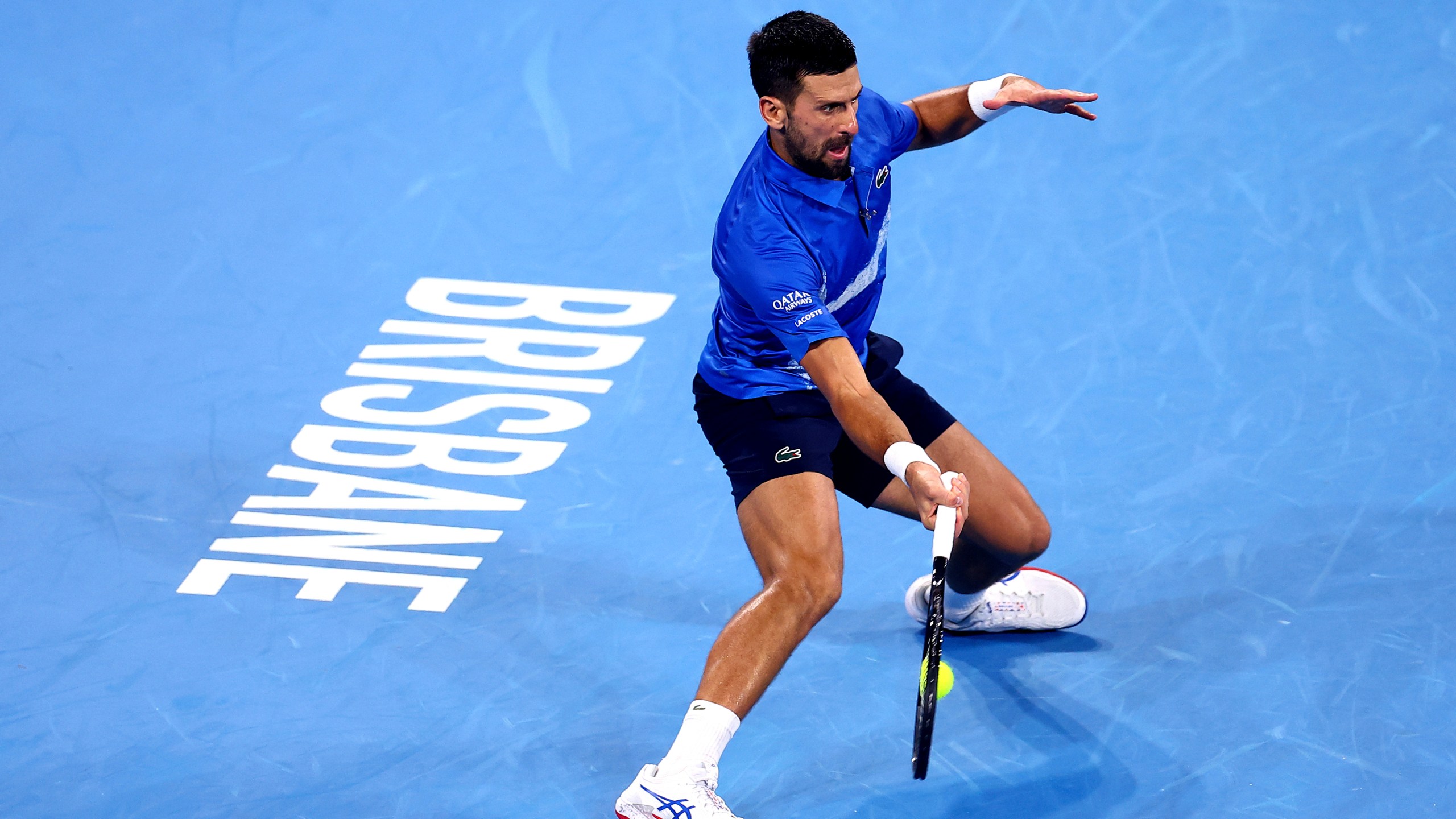 Serbia's Novak Djokovic plays a forehand to USA's Reilly Opelka during their match at the Brisbane International in Brisbane, Australia, Friday, Jan. 3, 2025. (AP Photo/Pat Hoelscher)