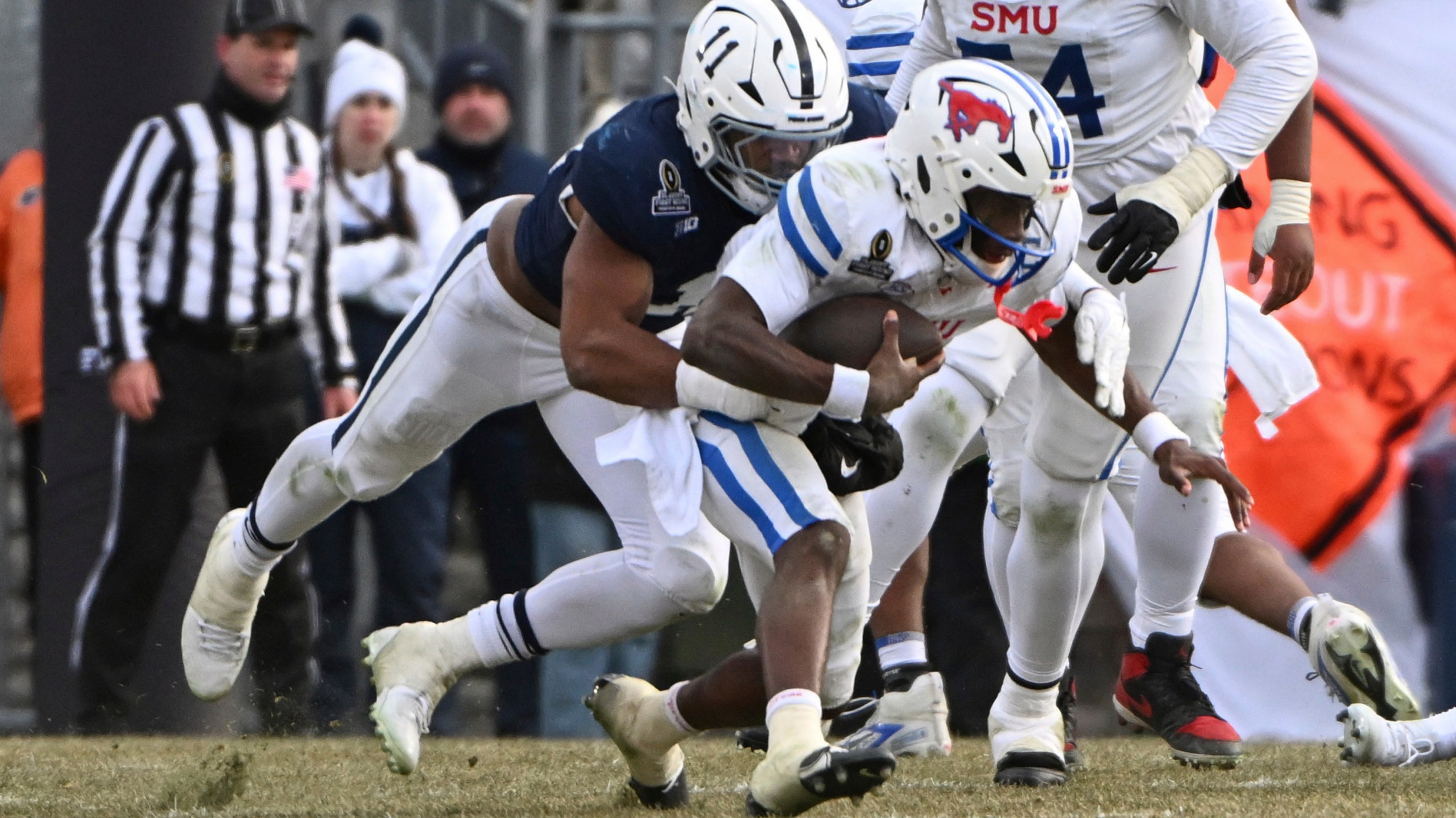 Penn State defensive end Abdul Carter sacks SMU quarterback Kevin Jennings during the second half in the first round of the College Football Playoff, Saturday, Dec. 21, 2024, in State College, Pa. (AP Photo/Barry Reeger)