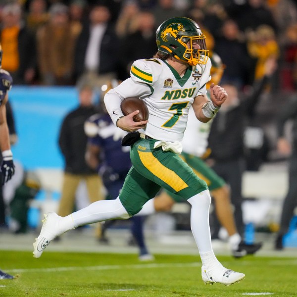 North Dakota State quarterback Cam Miller breaks away from Montana State defensive back Rylan Ortt for a long touchdown run during the first half of the FCS Championship NCAA college football game, Monday, Jan. 6, 2025, in Frisco, Texas. (AP Photo/Julio Cortez)