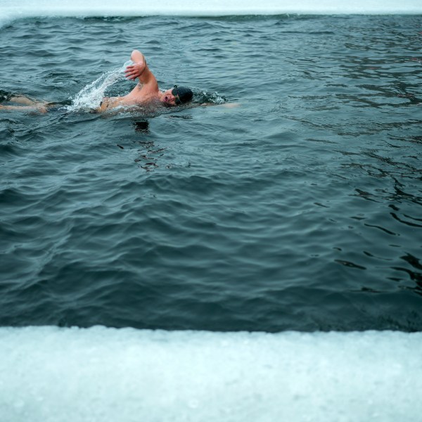 A resident swims in a pool carved from ice on the frozen Songhua river in Harbin in northeastern China's Heilongjiang province, Tuesday, Jan. 7, 2025. (AP Photo/Andy Wong)