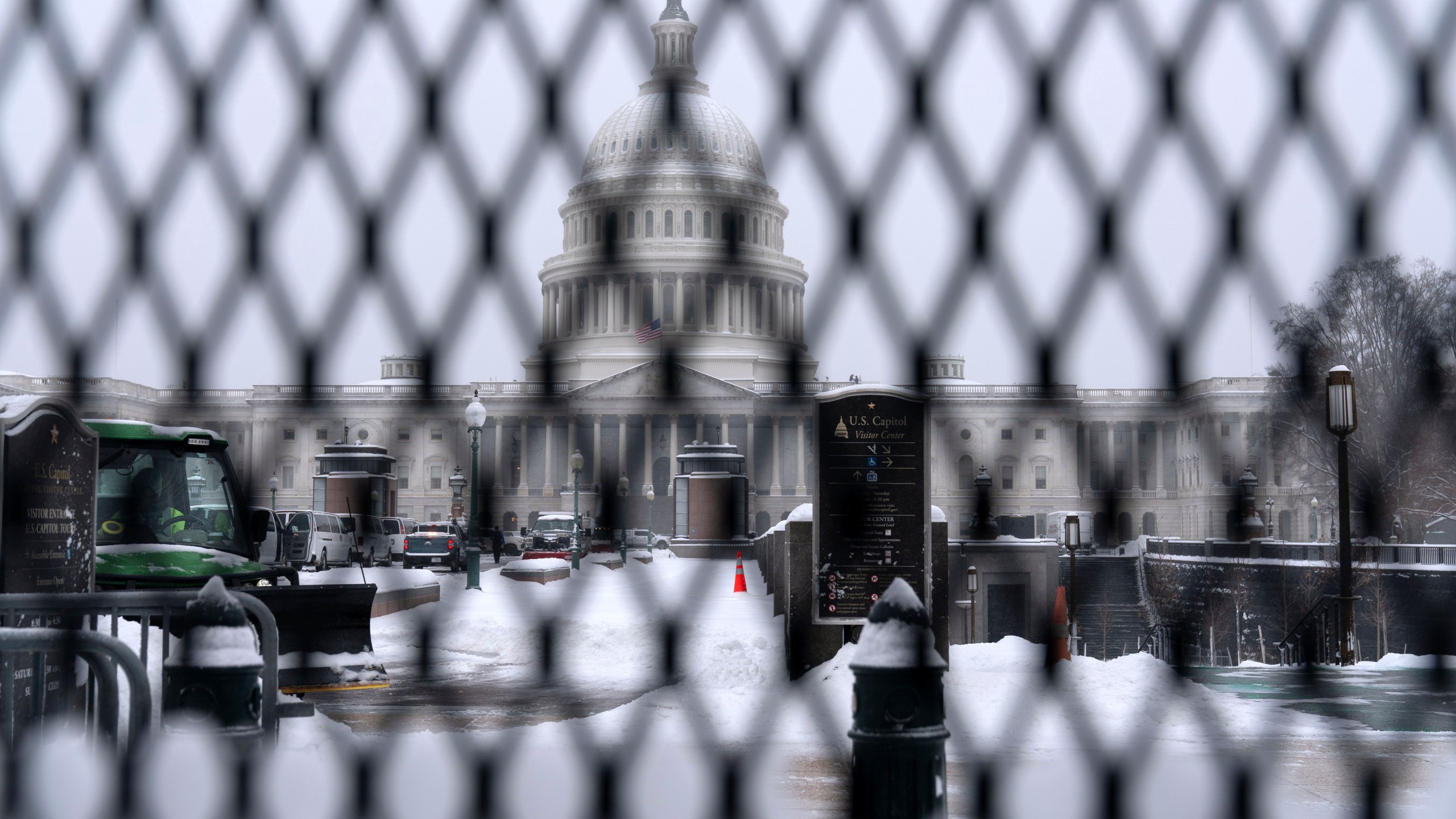 A snowplow clears the area as snow blankets Capitol Hill ahead of a joint session of Congress to certify the votes from the Electoral College in the presidential election in Washington, Monday, Jan. 6, 2025. (AP Photo/Jose Luis Magana)