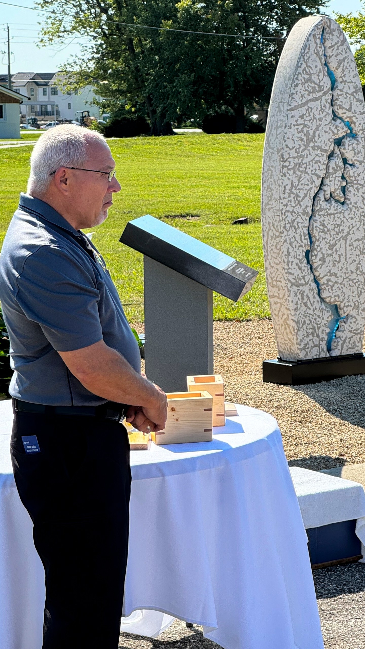 Hamilton County Coroner Jeff Jellison stands on August 29, 2024, in Westfield, Indiana, during the dedication of a memorial honoring suspected serial killer Herbert Baumeister's nine known victims. (AP Photo/Rick Callahan)