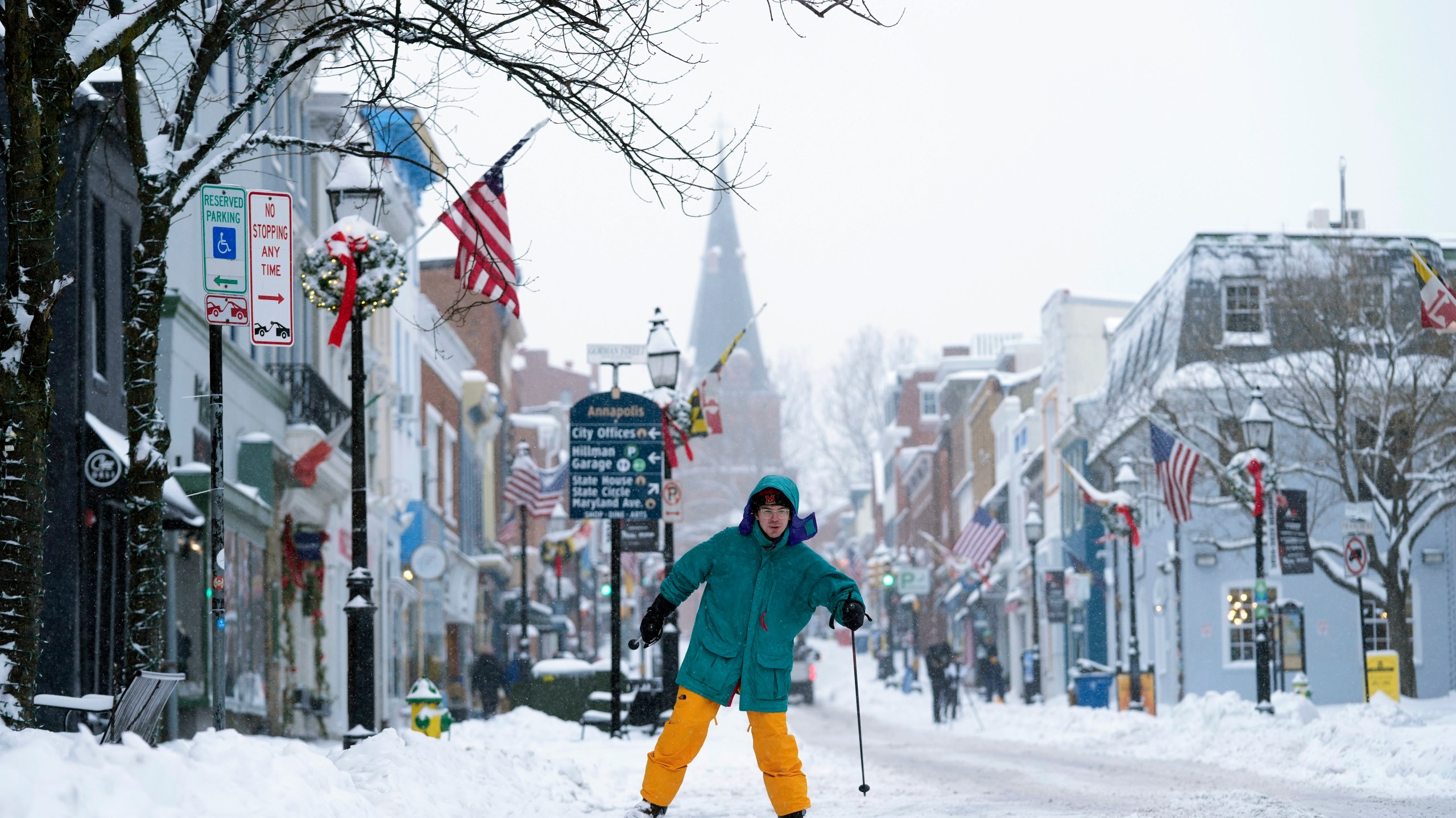 FILE - Cosimos Cendo, of Washington, D.C., skis down Main Street in Annapolis, Md., Monday, Jan. 6, 2025, during a snow storm. (AP Photo/Susan Walsh, File)