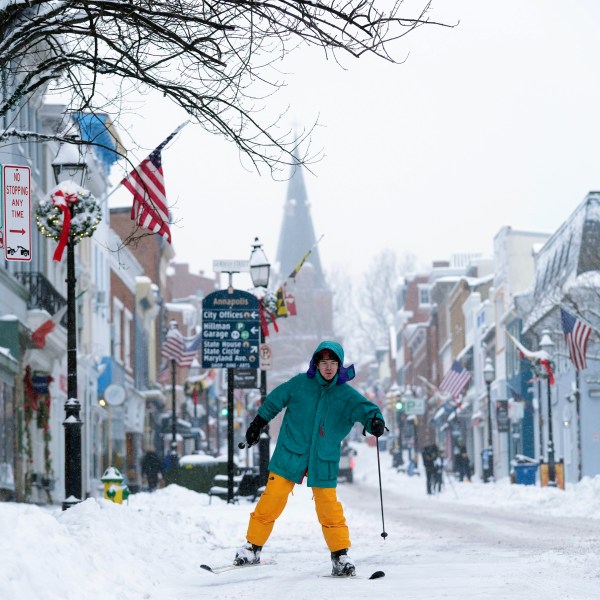 FILE - Cosimos Cendo, of Washington, D.C., skis down Main Street in Annapolis, Md., Monday, Jan. 6, 2025, during a snow storm. (AP Photo/Susan Walsh, File)