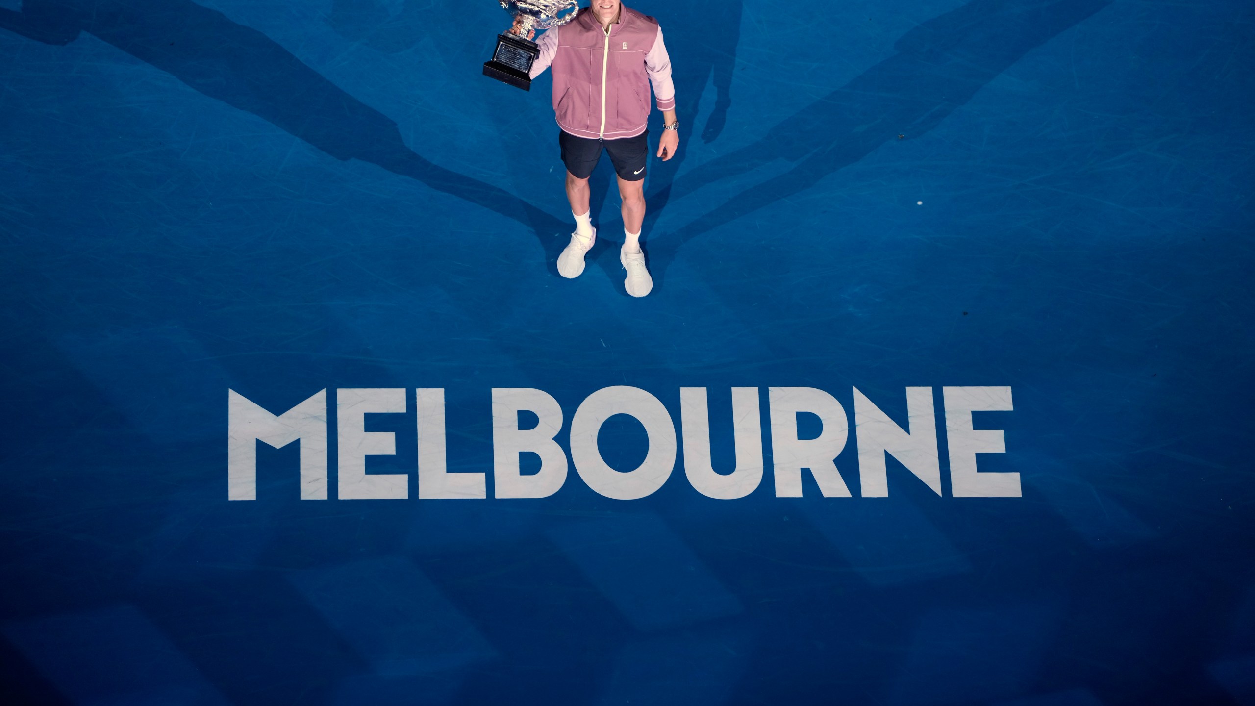 FILE - Jannik Sinner of Italy poses with the the Norman Brookes Challenge Cup after defeating Daniil Medvedev of Russia in the men's singles final at the Australian Open tennis championships at Melbourne Park, in Melbourne, Australia, Jan. 28, 2024. (AP Photo/Louise Delmotte, File)