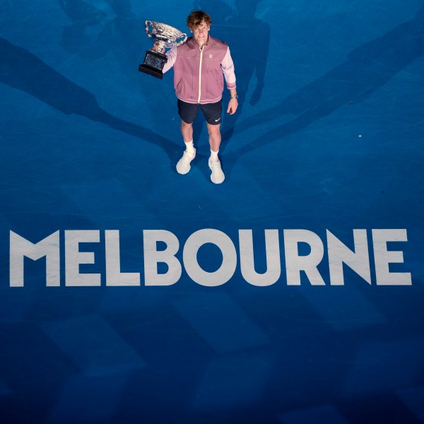 FILE - Jannik Sinner of Italy poses with the the Norman Brookes Challenge Cup after defeating Daniil Medvedev of Russia in the men's singles final at the Australian Open tennis championships at Melbourne Park, in Melbourne, Australia, Jan. 28, 2024. (AP Photo/Louise Delmotte, File)