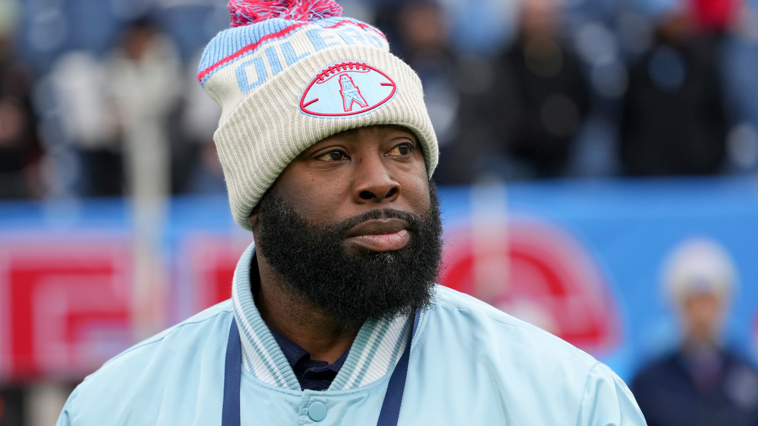 Tennessee Titans general manager Ran Carthon watches the team warm up before an NFL football game against the Houston Texans, Sunday, Jan. 5, 2025, in Nashville, Tenn. (AP Photo/George Walker IV)