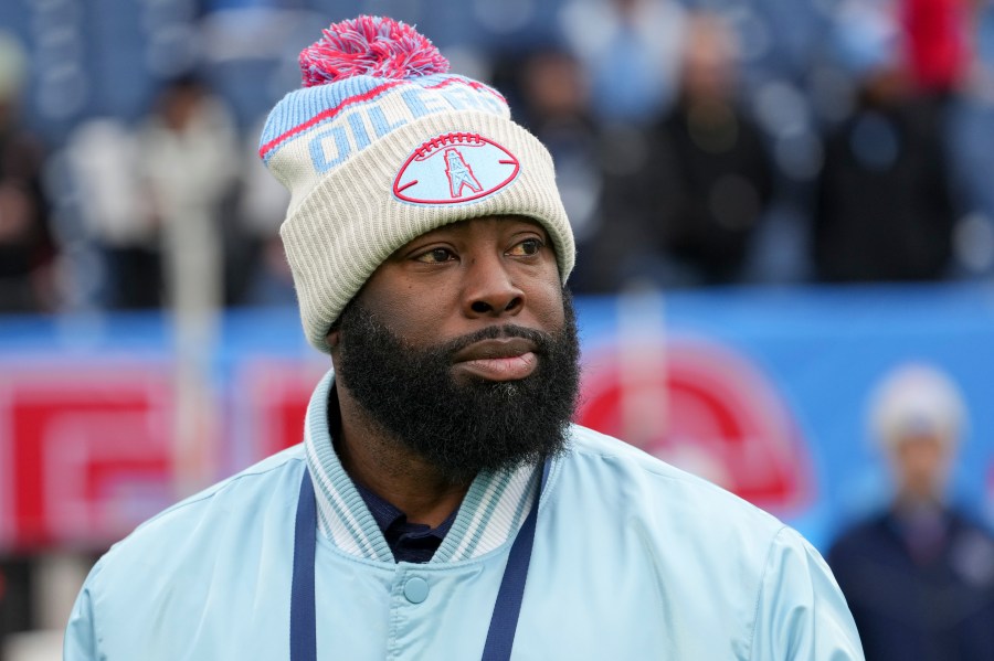 Tennessee Titans general manager Ran Carthon watches the team warm up before an NFL football game against the Houston Texans, Sunday, Jan. 5, 2025, in Nashville, Tenn. (AP Photo/George Walker IV)