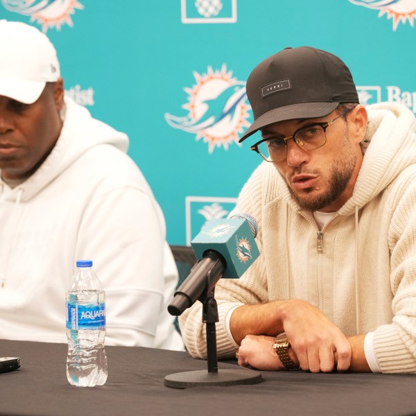 Miami Dolphins head coach Mike McDaniel speaks as general manager Chris Grier listens during a post season news conference, Tuesday, Jan. 7, 2025, in Miami Gardens, Fla. (AP Photo/Marta Lavandier)