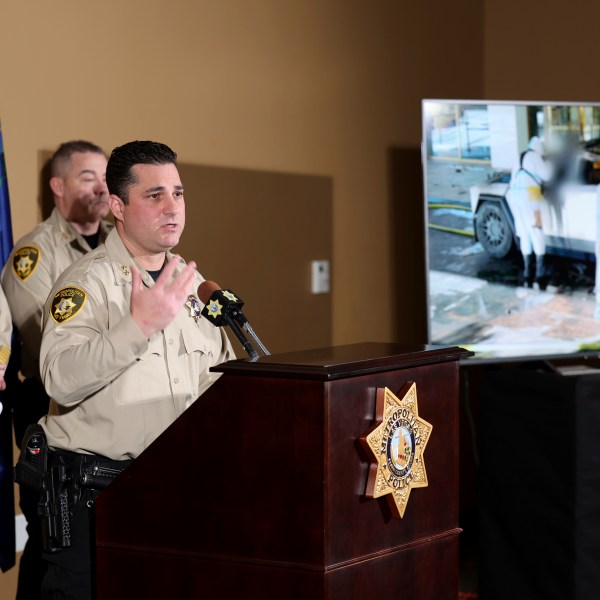 Metropolitan Police Department Assistant Sheriff Dori Koren shows a photo of the investigation into a Tesla Cybertruck that exploded at the Trump International Hotel, during a news conference at Metropolitan Police Department headquarters in Las Vegas, Tuesday, Jan. 7, 2025. (K.M. Cannon/Las Vegas Review-Journal via AP)