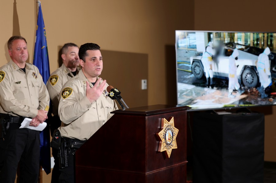 Metropolitan Police Department Assistant Sheriff Dori Koren shows a photo of the investigation into a Tesla Cybertruck that exploded at the Trump International Hotel, during a news conference at Metropolitan Police Department headquarters in Las Vegas, Tuesday, Jan. 7, 2025. (K.M. Cannon/Las Vegas Review-Journal via AP)