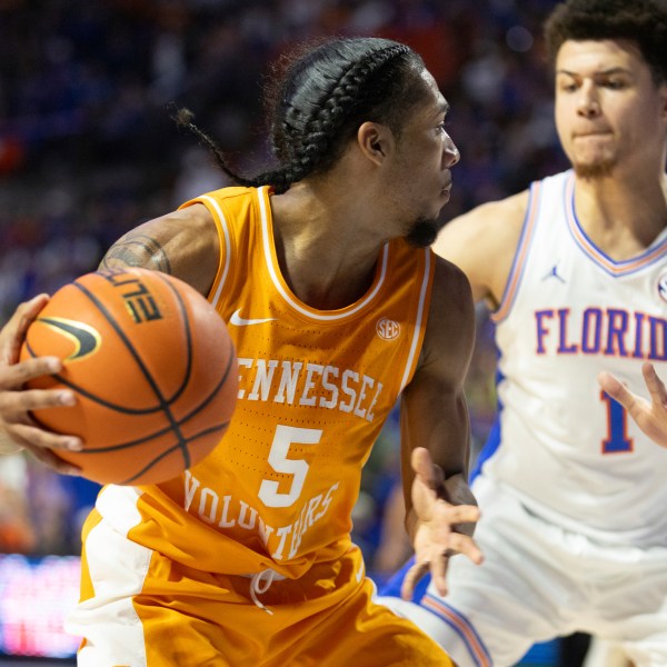 Tennessee guard Zakai Zeigler (5) drives on Florida guard Walter Clayton Jr. (1) during the first half of an NCAA college basketball game Tuesday, Jan. 7, 2025, in Gainesville, Fla. (AP Photo/Alan Youngblood)