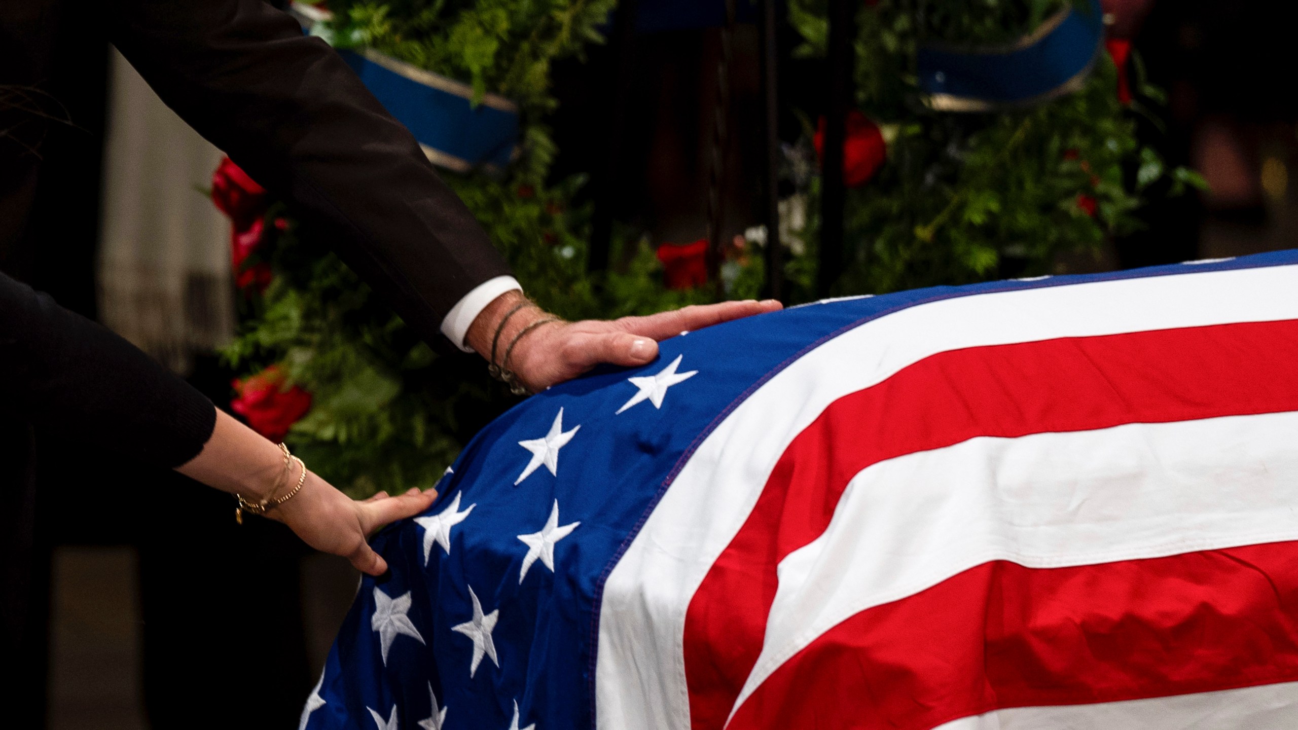 The Carter family pay their respects during a ceremony as the flag-draped casket of former President Jimmy Carter lies in state, at the Capitol, Tuesday, Jan. 7, 2025, in Washington. Carter died Dec. 29 at the age of 100. (Kent Nishimura/The New York Times via AP, Pool)