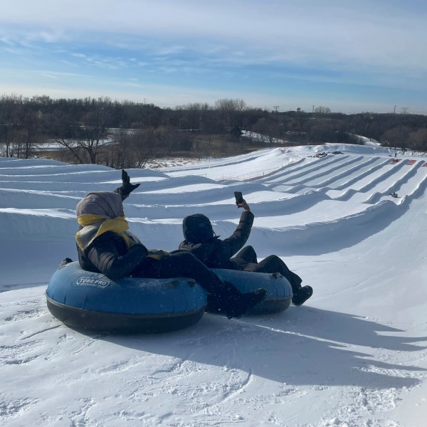 Sisters Ruun Mahamud, left, and Nawal Hirsi go snow tubing during an outing organized by the group Habib founded to promote outdoors activities among Muslim women, at Elm Creek Park Reserve in Maple Grove, Minn., on Jan. 4, 2025. (AP Photo/Giovanna Dell'Orto)