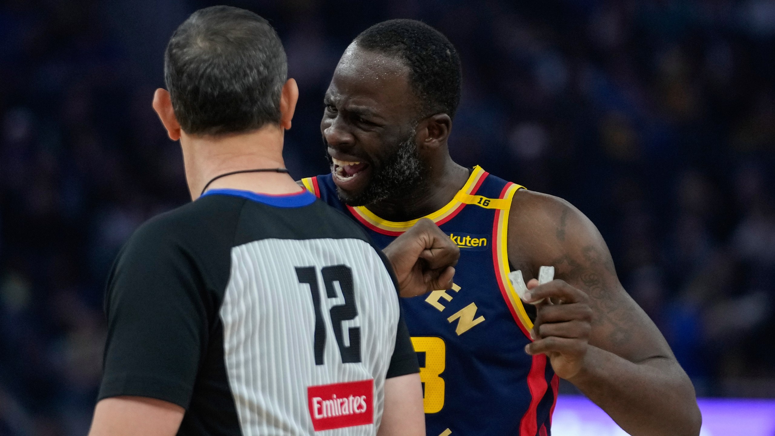 Golden State Warriors forward Draymond Green, right, speaks with referee J.T. Orr during the first half of an NBA basketball game against the Miami Heat, Tuesday, Jan. 7, 2025, in San Francisco. (AP Photo/Godofredo A. Vásquez)