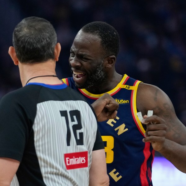 Golden State Warriors forward Draymond Green, right, speaks with referee J.T. Orr during the first half of an NBA basketball game against the Miami Heat, Tuesday, Jan. 7, 2025, in San Francisco. (AP Photo/Godofredo A. Vásquez)