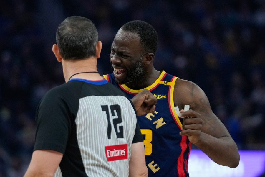 Golden State Warriors forward Draymond Green, right, speaks with referee J.T. Orr during the first half of an NBA basketball game against the Miami Heat, Tuesday, Jan. 7, 2025, in San Francisco. (AP Photo/Godofredo A. Vásquez)