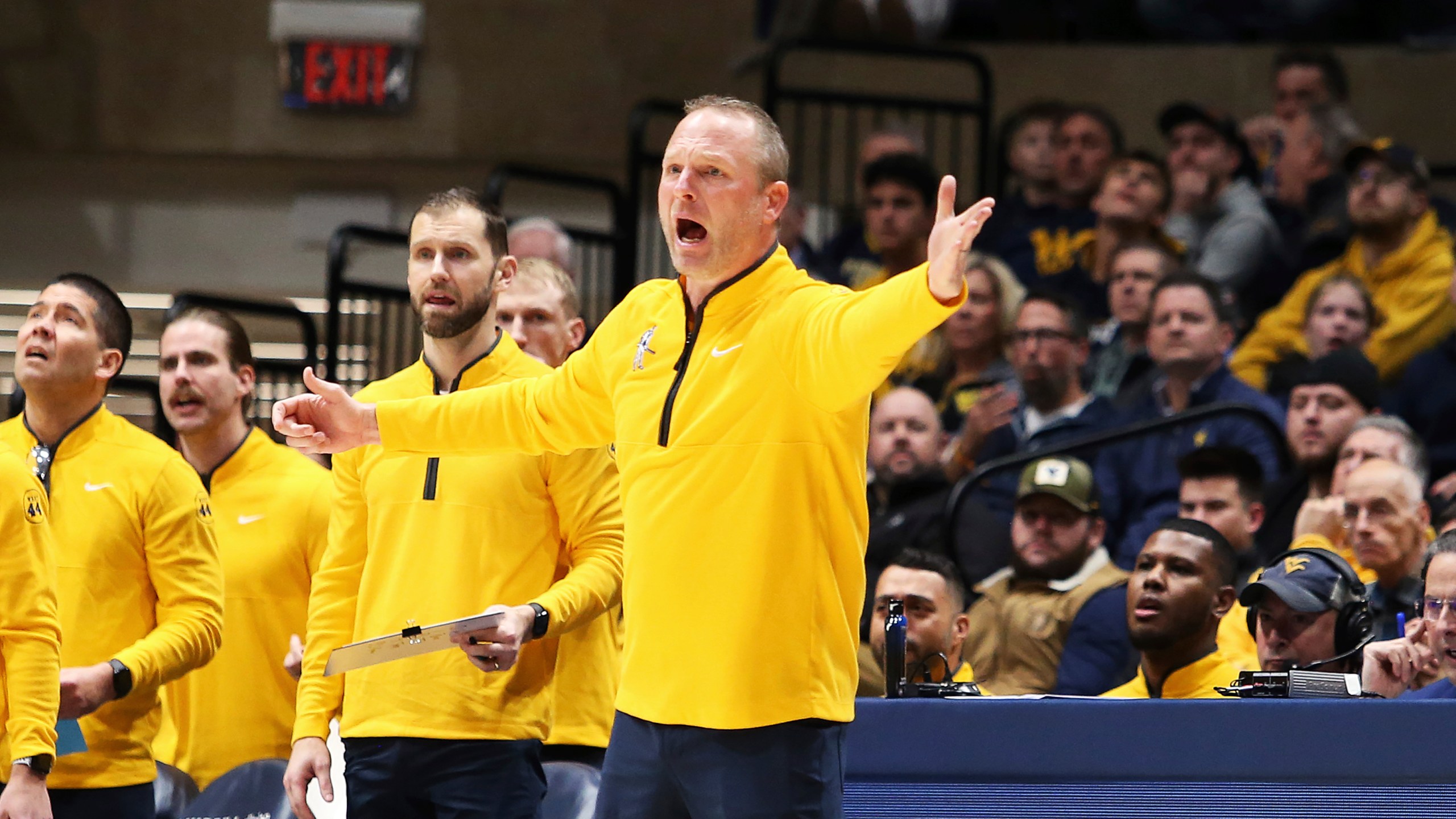 West Virginia coach Darian Devries reacts during the first half of an NCAA college basketball game against Arizona, Tuesday, Jan. 7, 2025, in Morgantown, W.Va. (AP Photo/Kathleen Batten)