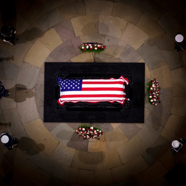 The flag-draped casket of former President Jimmy Carter lies in state at the rotunda of the U.S. Capitol Tuesday, Jan. 7, 2025, in Washington. (Andrew Harnik/Pool via AP)