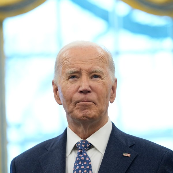 FILE - President Joe Biden pauses during a photo opportunity with Medal of Valor recipients in the Oval Office of the White House in Washington, Jan. 3, 2025. (AP Photo/Susan Walsh, File)