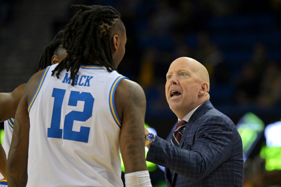 UCLA head coach Mick Cronin instructs UCLA guard Sebastian Mack (12) during the first half of an NCAA college basketball game against Michigan, Tuesday, Jan. 7, 2025, in Los Angeles. (AP Photo/Jayne Kamin-Oncea)