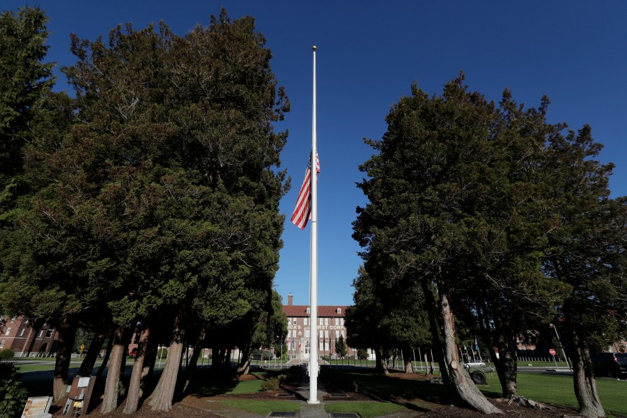 FILE - The main flag pole in front of the U.S. Army I Corps headquarters on Joint Base Lewis-McChord, south of Tacoma, Wash., hangs at half-staff, Wednesday, Dec. 5, 2018. (AP Photo/Ted S. Warren, File)