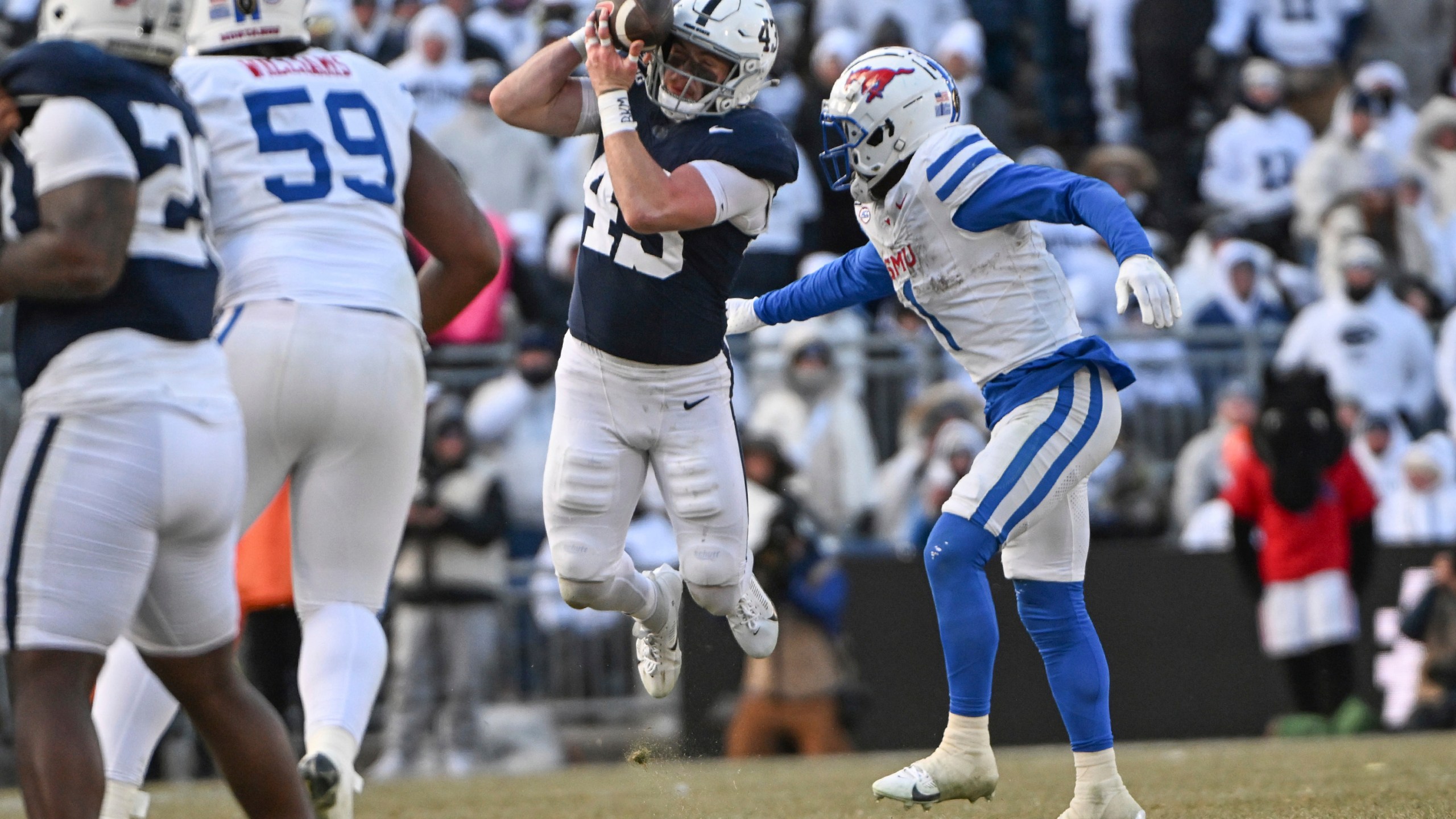 Penn State linebacker Tyler Elsdon (43) breaks up a pass intended for SMU running back Brashard Smith (1) during the second half in the first round of the College Football Playoff, Saturday, Dec. 21, 2024, in State College, Pa. (AP Photo/Barry Reeger)