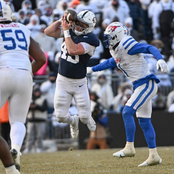 Penn State linebacker Tyler Elsdon (43) breaks up a pass intended for SMU running back Brashard Smith (1) during the second half in the first round of the College Football Playoff, Saturday, Dec. 21, 2024, in State College, Pa. (AP Photo/Barry Reeger)