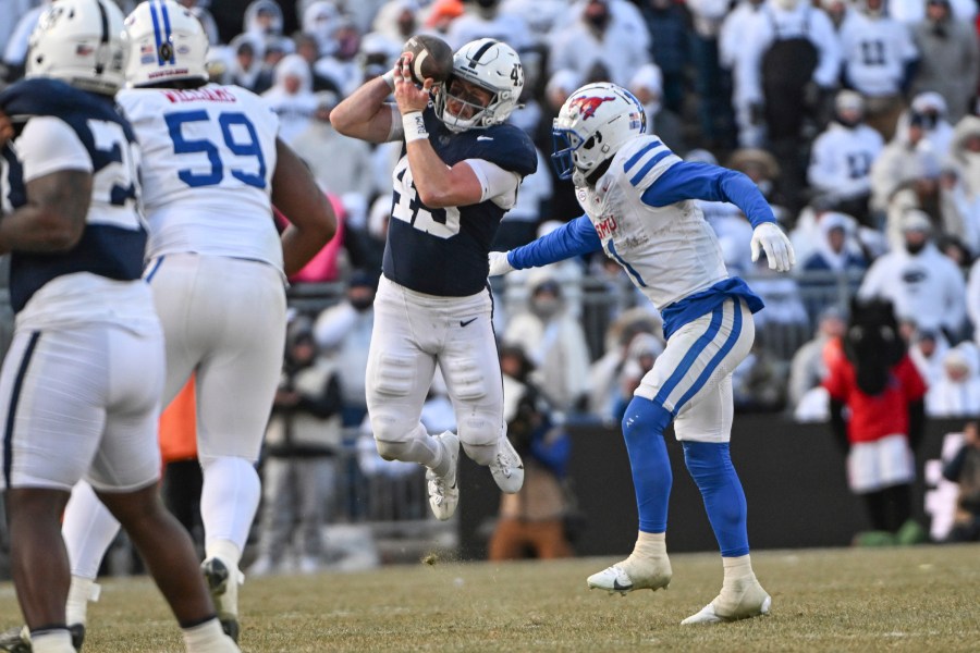 Penn State linebacker Tyler Elsdon (43) breaks up a pass intended for SMU running back Brashard Smith (1) during the second half in the first round of the College Football Playoff, Saturday, Dec. 21, 2024, in State College, Pa. (AP Photo/Barry Reeger)