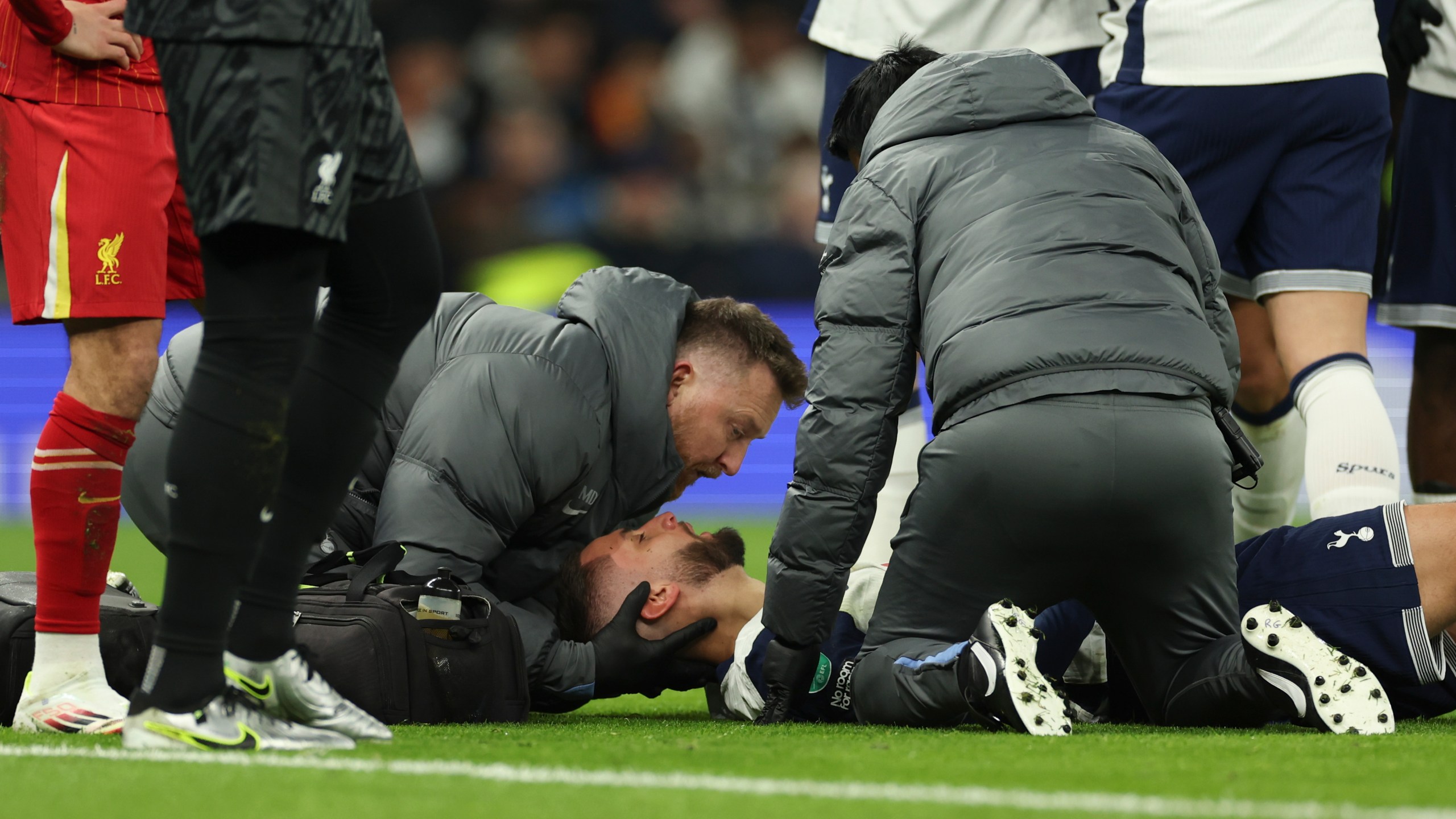 Tottenham's Rodrigo Bentancur receives medical treatment during the English League Cup semi final first leg soccer match between Tottenham and Liverpool, at the Tottenham Hotspur Stadium in London, Wednesday, Jan. 8, 2025. (AP Photo/Ian Walton)