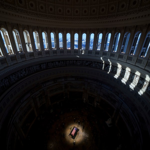 The flag-draped casket of former President Jimmy Carter lies in state at the rotunda of the U.S. Capitol, Wednesday, Jan. 8, 2025, in Washington. (Andrew Harnik/Pool via AP)