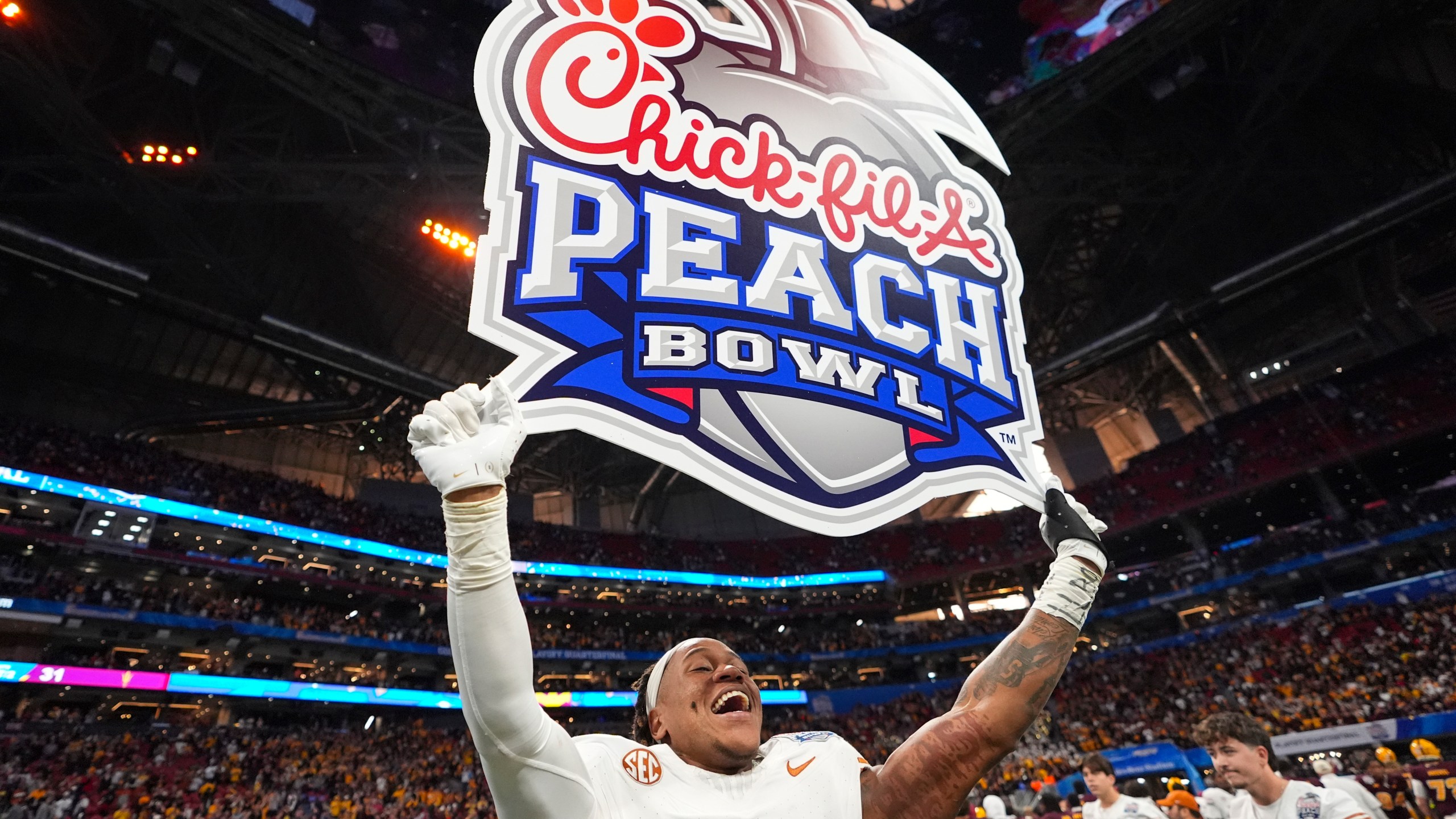 Texas linebacker Morice Blackwell Jr. (37) celebrates victory after a quarterfinals College Football Playoff game against Arizona State, Wednesday, Jan. 1, 2025, in Atlanta. Texas won 39-31 in two overtime periods. (AP Photo/Brynn Anderson)