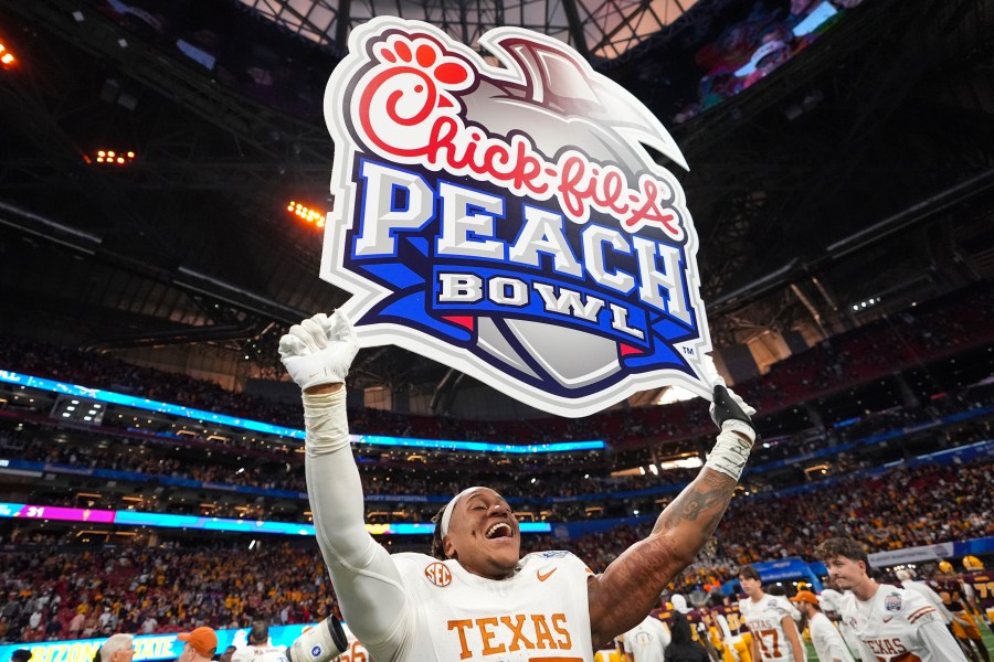 Texas linebacker Morice Blackwell Jr. (37) celebrates victory after a quarterfinals College Football Playoff game against Arizona State, Wednesday, Jan. 1, 2025, in Atlanta. Texas won 39-31 in two overtime periods. (AP Photo/Brynn Anderson)