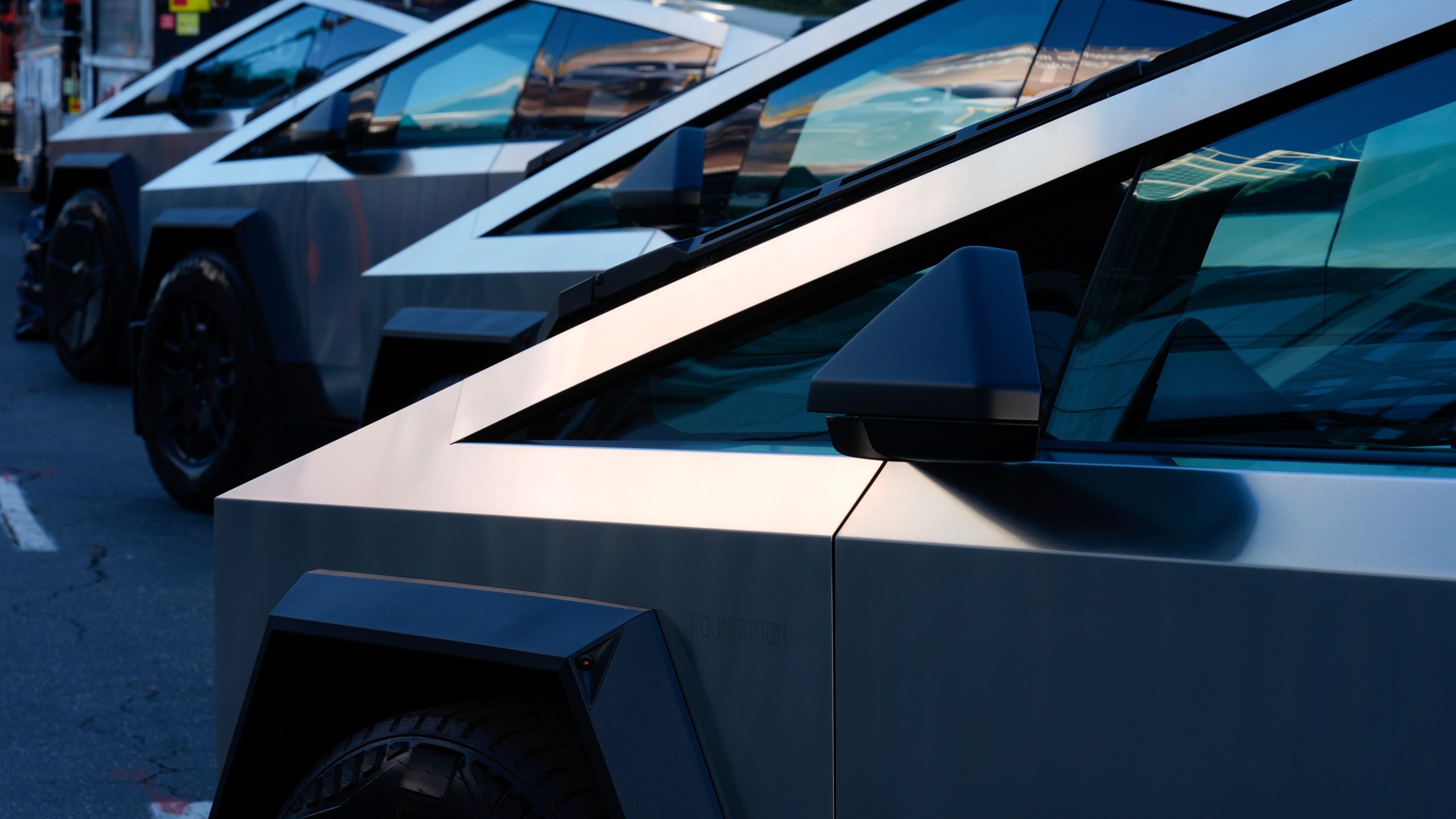 FILE - Tesla Cybertrucks are displayed at the AutoMobility LA Auto Show, Nov. 21, 2024, in Los Angeles. (AP Photo/Damian Dovarganes, File)