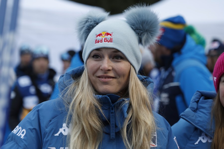 Alpine ski great United States Lindsey Vonn watches the 10km women's mass start race of the Tour de Ski cross country, in Val di Fiemme, Italy, Sunday, Jan. 5, 2025. (AP Photo/Alessandro Trovati)