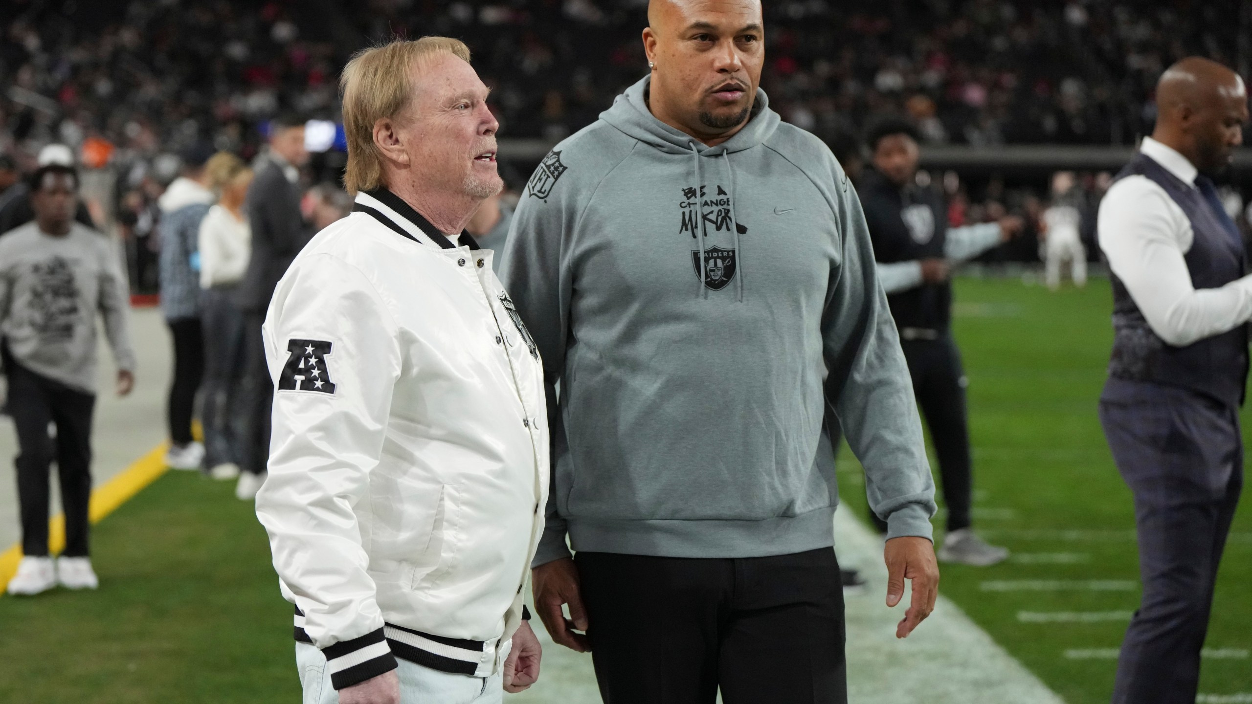 Las Vegas Raiders owner Mark Davis talks with head coach Antonio Pierce, right, prior to an NFL football game against the Atlanta Falcons, Monday, Dec. 16, 2024, in Las Vegas. (AP Photo/Rick Scuteri)