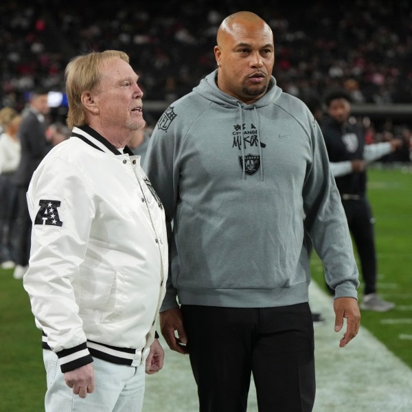 Las Vegas Raiders owner Mark Davis talks with head coach Antonio Pierce, right, prior to an NFL football game against the Atlanta Falcons, Monday, Dec. 16, 2024, in Las Vegas. (AP Photo/Rick Scuteri)