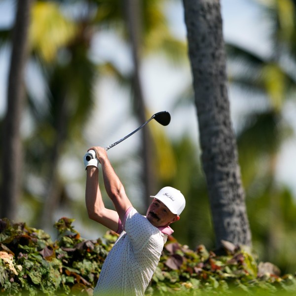 Paul Peterson hits on the 18th hole during the first round of the Sony Open golf event, Thursday, Jan. 9, 2025, at Waialae Country Club in Honolulu. (AP Photo/Matt York)