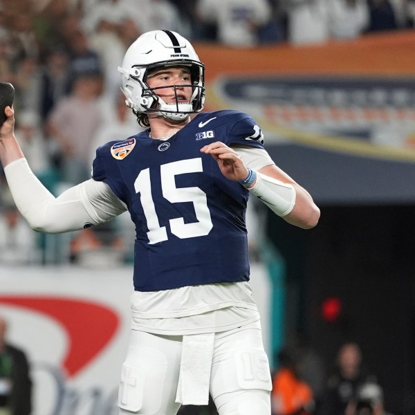 Penn State quarterback Drew Allar (15) throws for a touchdown during the first half of the Orange Bowl NCAA College Football Playoff semifinal game against Notre Dame, Thursday, Jan. 9, 2025, in Miami Gardens, Fla. (AP Photo/Rebecca Blackwell)