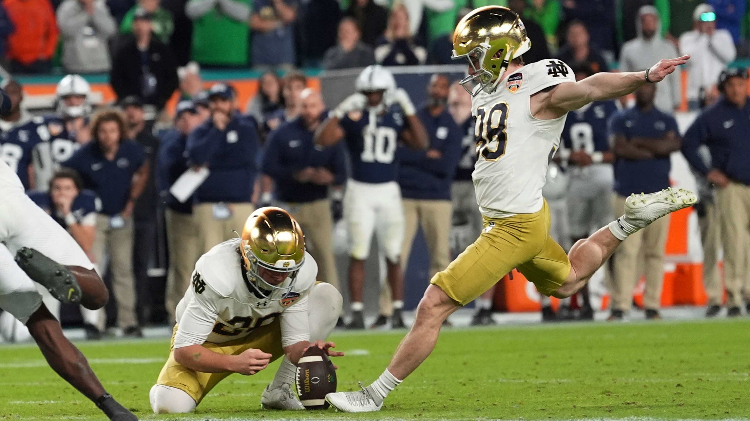 Notre Dame place kicker Mitch Jeter (98) kicks the game winning field goal during the second half of the Orange Bowl College Football Playoff semifinal game against Penn State Thursday, Jan. 9, 2025, in Miami Gardens, Fla. (AP Photo/Rebecca Blackwell)