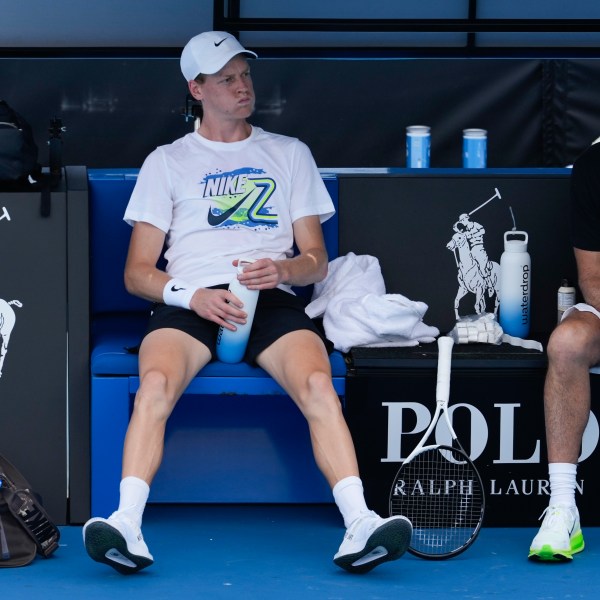 Italy's Jannik Sinner takes a break during a practice session ahead of the Australian Open tennis championship in Melbourne, Australia, Friday, Jan. 10, 2025. (AP Photo/Manish Swarup)